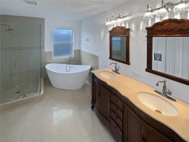 11356 Callaway Pond Dr, Riverview, FL 33579 - bathroom with a stall shower, a freestanding tub, double vanity, and tile patterned floors