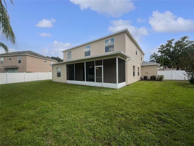 11356 Callaway Pond Dr, Riverview, FL 33579 - rear view of property featuring stucco siding, a sunroom, and a fenced backyard