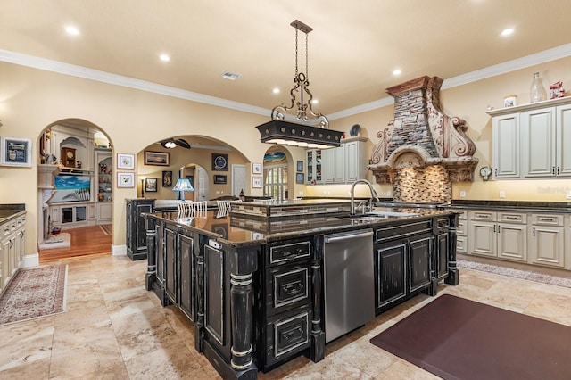 9400 Laws Rd, Clermont, FL 34714 - kitchen featuring dishwasher, dark cabinets, a center island with sink, crown molding, and arched walkways