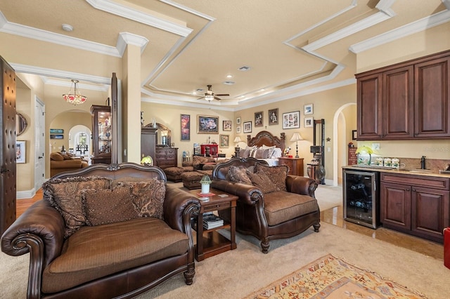 9400 Laws Rd, Clermont, FL 34714 - living room with beverage cooler, arched walkways, ornamental molding, wet bar, and a ceiling fan