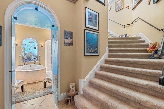9400 Laws Rd, Clermont, FL 34714 - stairs with tile patterned floors and baseboards