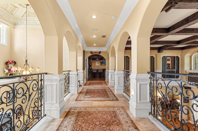 9400 Laws Rd, Clermont, FL 34714 - hall with a decorative wall, arched walkways, wainscoting, recessed lighting, and beamed ceiling
