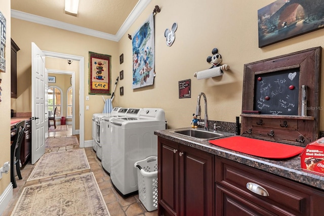 9400 Laws Rd, Clermont, FL 34714 - washroom featuring washing machine and dryer, ornamental molding, light stone finish floors, and cabinet space