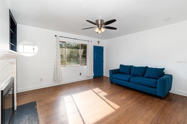 131 N Central Ave, Apopka, FL 32703 - living area featuring a fireplace with flush hearth, ceiling fan, wood finished floors, and wine cooler