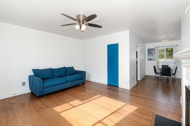 131 N Central Ave, Apopka, FL 32703 - unfurnished room with ceiling fan, wood finished floors, and a fireplace with flush hearth