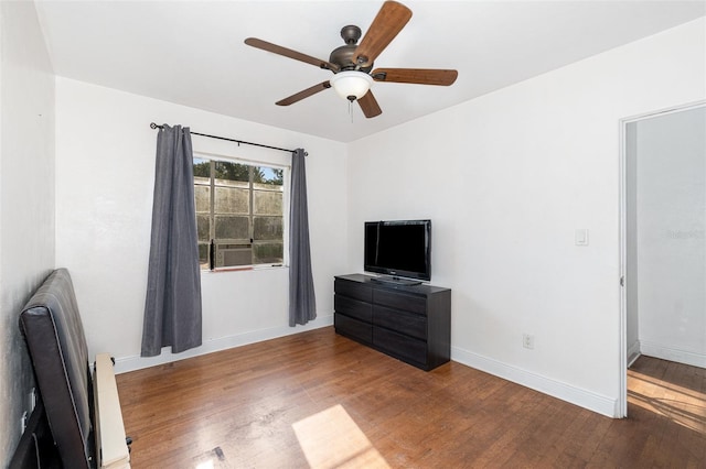 131 N Central Ave, Apopka, FL 32703 - unfurnished bedroom with wood finished floors, ceiling fan, and radiator heating unit