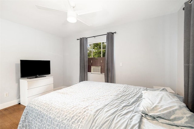 131 N Central Ave, Apopka, FL 32703 - bedroom with wood finished floors, cooling unit, and a ceiling fan