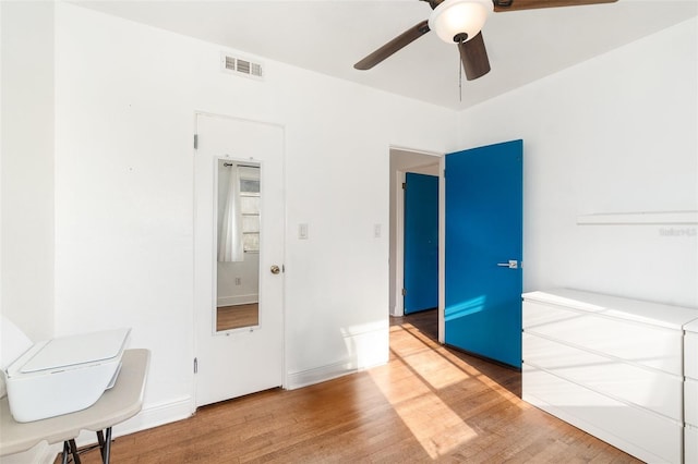 131 N Central Ave, Apopka, FL 32703 - unfurnished bedroom featuring wood finished floors and ceiling fan