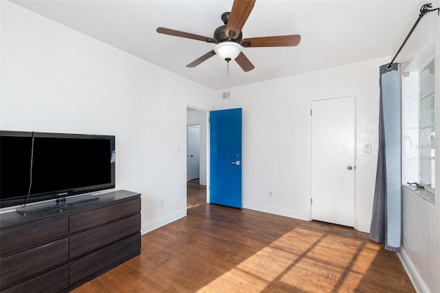 131 N Central Ave, Apopka, FL 32703 - unfurnished bedroom with wood finished floors and a ceiling fan