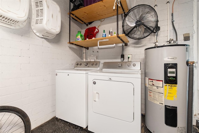 131 N Central Ave, Apopka, FL 32703 - laundry room with electric water heater, washer and clothes dryer, and concrete block wall