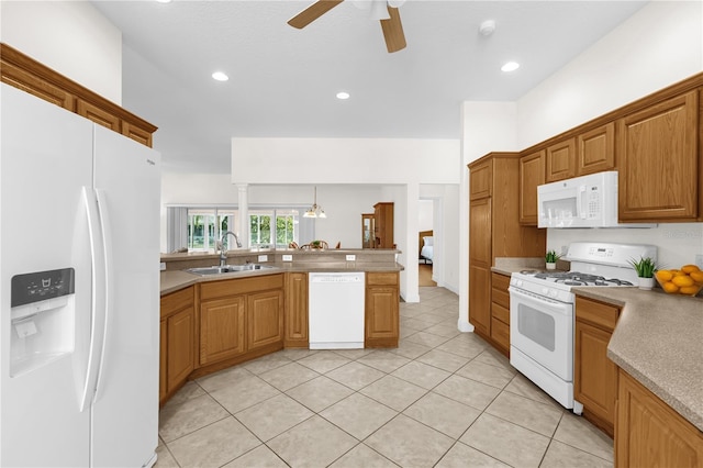 1254 Spartanburg Way, The Villages, FL 32162 - kitchen featuring white appliances, ceiling fan, a peninsula, light countertops, and light tile patterned flooring