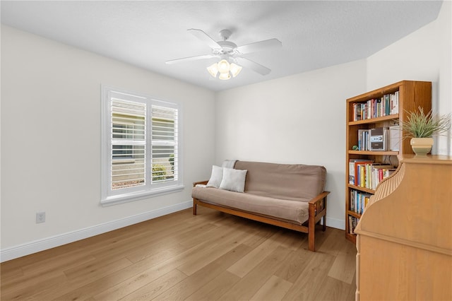 1254 Spartanburg Way, The Villages, FL 32162 - living area featuring light wood finished floors and a ceiling fan