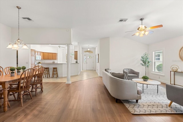 1254 Spartanburg Way, The Villages, FL 32162 - living room with a ceiling fan, light wood-style floors, and lofted ceiling