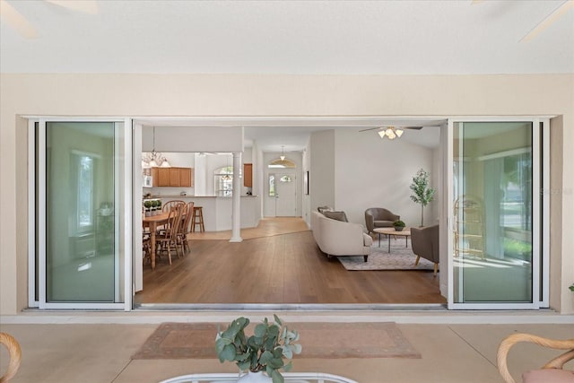 1254 Spartanburg Way, The Villages, FL 32162 - living area with wood finished floors and decorative columns