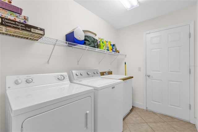 1254 Spartanburg Way, The Villages, FL 32162 - laundry area with separate washer and dryer and light tile patterned floors
