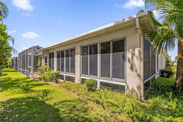 1254 Spartanburg Way, The Villages, FL 32162 - view of side of home featuring a lawn and stucco siding