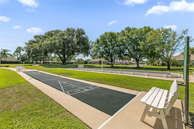1254 Spartanburg Way, The Villages, FL 32162 - view of community featuring shuffleboard, a yard, and uncovered parking