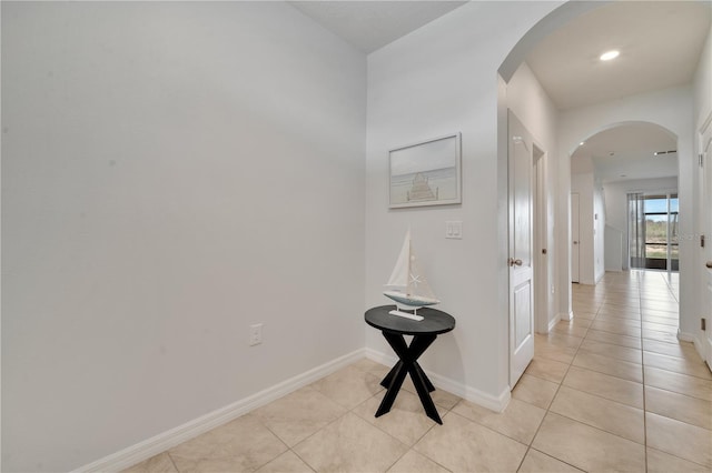 200 Feltrim Reserve Blvd, Davenport, FL 33837 - hall with arched walkways, light tile patterned floors, and recessed lighting