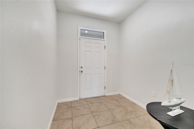 200 Feltrim Reserve Blvd, Davenport, FL 33837 - entryway featuring light tile patterned flooring and baseboards