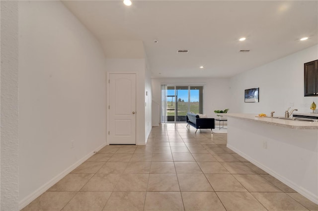 200 Feltrim Reserve Blvd, Davenport, FL 33837 - kitchen featuring light countertops, recessed lighting, and light tile patterned floors