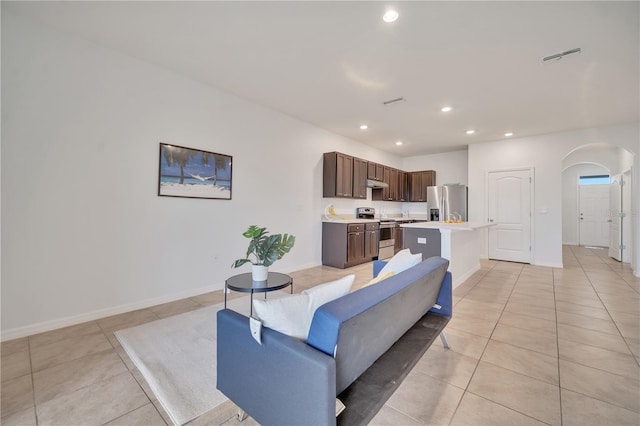 200 Feltrim Reserve Blvd, Davenport, FL 33837 - living area featuring arched walkways, light tile patterned floors, and recessed lighting