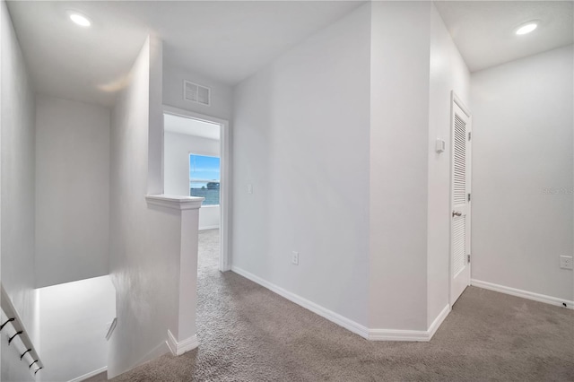 200 Feltrim Reserve Blvd, Davenport, FL 33837 - hall with carpet floors, an upstairs landing, and recessed lighting