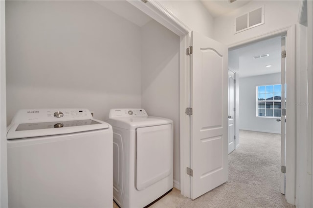 200 Feltrim Reserve Blvd, Davenport, FL 33837 - washroom with washer and dryer and light colored carpet