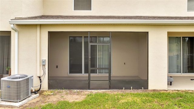 200 Feltrim Reserve Blvd, Davenport, FL 33837 - view of property exterior with a cooling unit and stucco siding