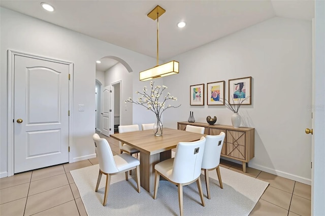 200 Feltrim Reserve Blvd, Davenport, FL 33837 - dining area featuring light tile patterned flooring, arched walkways, vaulted ceiling, and recessed lighting