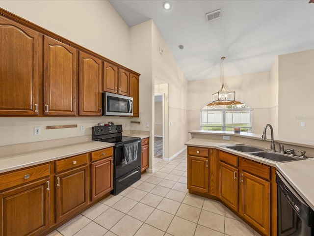 14322 Pine Cone Trl, Clermont, FL 34711 - kitchen with black appliances, light tile patterned flooring, lofted ceiling, brown cabinets, and recessed lighting
