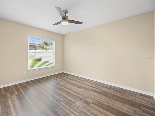 14322 Pine Cone Trl, Clermont, FL 34711 - unfurnished room with wood finished floors and ceiling fan