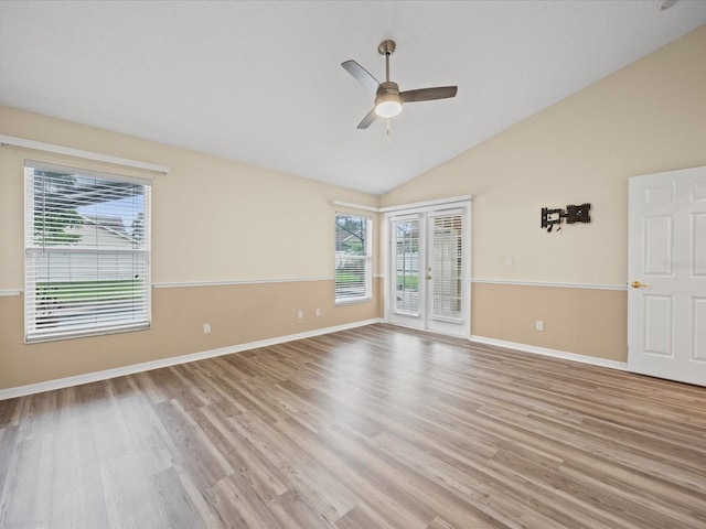 14322 Pine Cone Trl, Clermont, FL 34711 - unfurnished room with a ceiling fan, plenty of natural light, light wood-style floors, and high vaulted ceiling