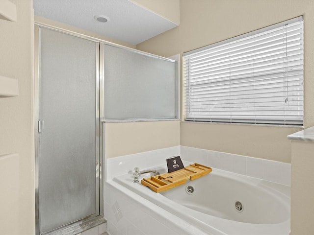 14322 Pine Cone Trl, Clermont, FL 34711 - full bathroom with a shower stall and a tub with jets