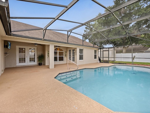 14322 Pine Cone Trl, Clermont, FL 34711 - view of pool with french doors, a patio, ceiling fan, a storage shed, and glass enclosure