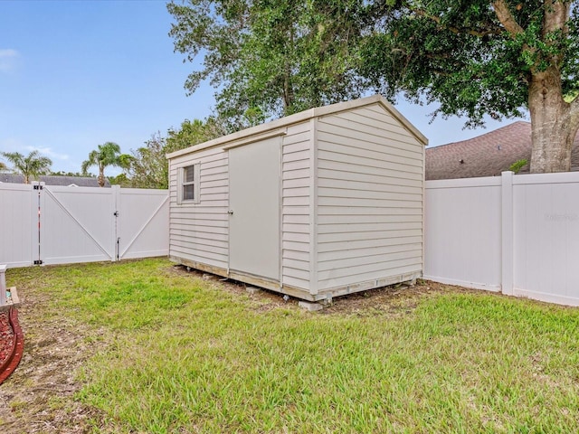 14322 Pine Cone Trl, Clermont, FL 34711 - view of shed with a gate and a fenced backyard