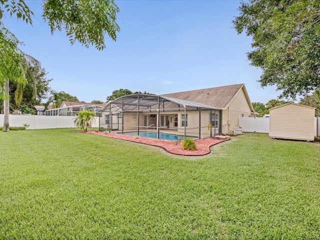 14322 Pine Cone Trl, Clermont, FL 34711 - back of house featuring a fenced backyard, a storage unit, and a lanai