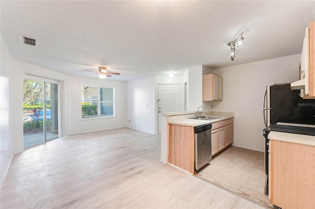 711 Sugar Bay Way Unit 109, Lake Mary, FL 32746 - kitchen with appliances with stainless steel finishes, a textured ceiling, ceiling fan, light countertops, and open floor plan