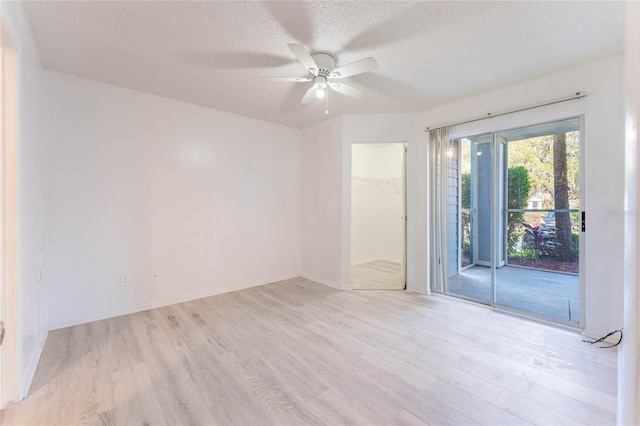 711 Sugar Bay Way Unit 109, Lake Mary, FL 32746 - unfurnished room featuring a ceiling fan, light wood-style floors, and a textured ceiling