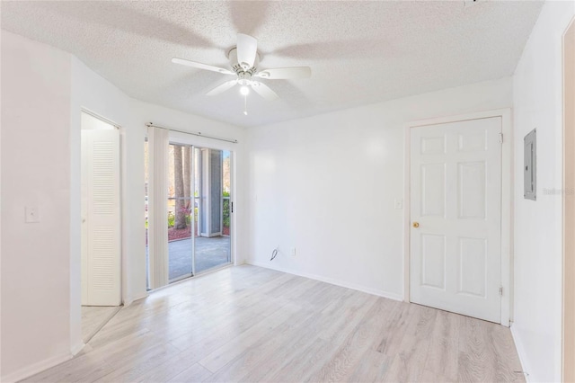 711 Sugar Bay Way Unit 109, Lake Mary, FL 32746 - unfurnished room with light wood-type flooring, a ceiling fan, a textured ceiling, and electric panel