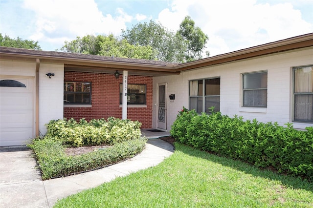2417 Bayfront Pkwy, Orlando, FL 32806 - property entrance with a garage and brick siding