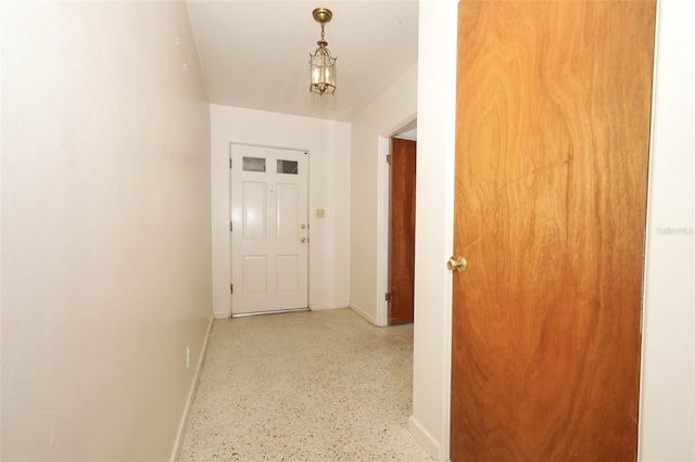 2417 Bayfront Pkwy, Orlando, FL 32806 - hall with baseboards and speckled floor
