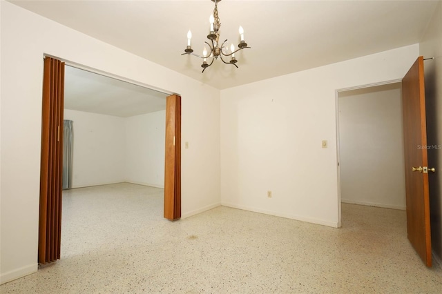 2417 Bayfront Pkwy, Orlando, FL 32806 - unfurnished room with a chandelier and speckled floor
