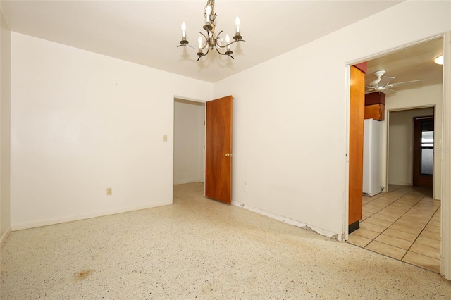 2417 Bayfront Pkwy, Orlando, FL 32806 - unfurnished room featuring a chandelier, speckled floor, and a ceiling fan