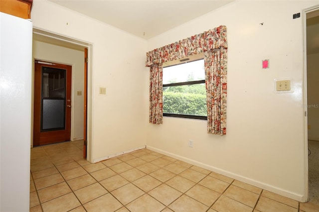2417 Bayfront Pkwy, Orlando, FL 32806 - spare room with light tile patterned floors and baseboards