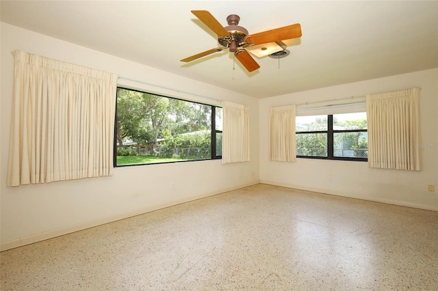 2417 Bayfront Pkwy, Orlando, FL 32806 - spare room featuring speckled floor and ceiling fan