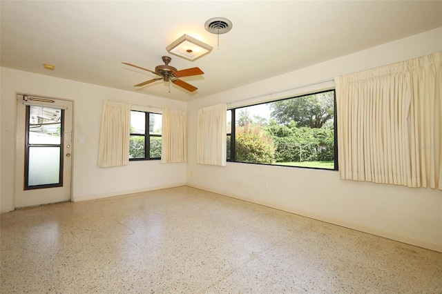 2417 Bayfront Pkwy, Orlando, FL 32806 - spare room featuring speckled floor and ceiling fan