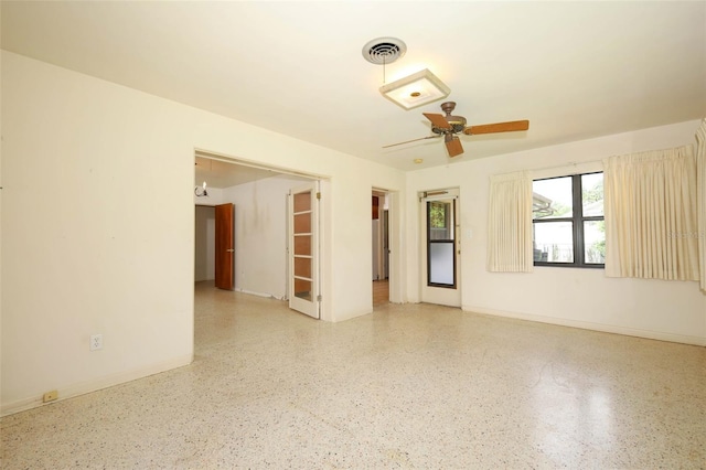 2417 Bayfront Pkwy, Orlando, FL 32806 - spare room featuring speckled floor and ceiling fan