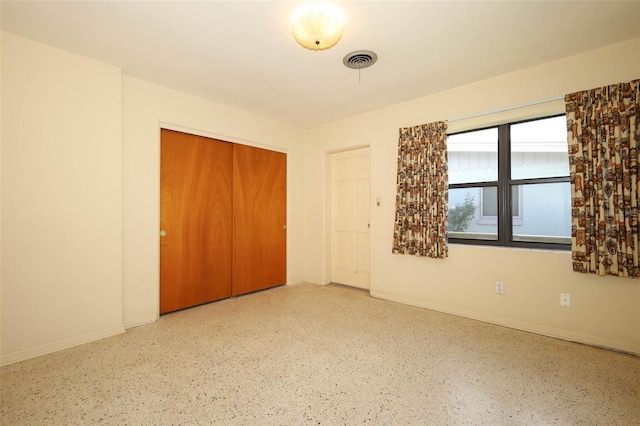 2417 Bayfront Pkwy, Orlando, FL 32806 - unfurnished bedroom with baseboards and a closet