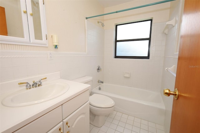 2417 Bayfront Pkwy, Orlando, FL 32806 - bathroom featuring vanity, bathing tub / shower combination, tile walls, and tile patterned floors