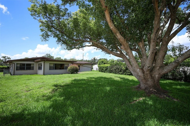 2417 Bayfront Pkwy, Orlando, FL 32806 - view of grassy yard with a garage